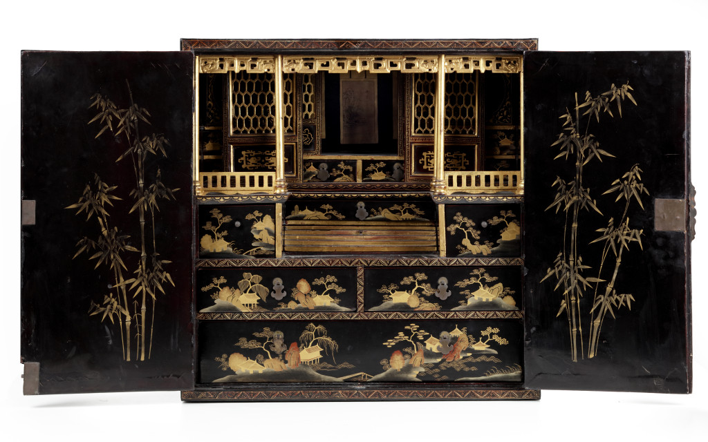 A Chinese black and gold lacquered cabinet with finely made interior with a poem made by Li Bai (701-762)