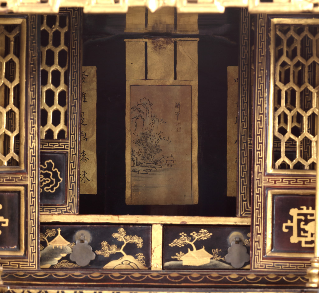 A Chinese black and gold lacquered cabinet with finely made interior with a poem made by Li Bai (701-762)