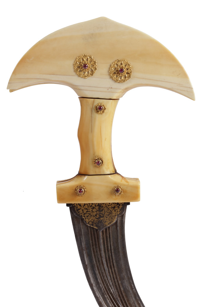 A fine Indian khandjarli dagger with a gold and gem-set ivory hilt