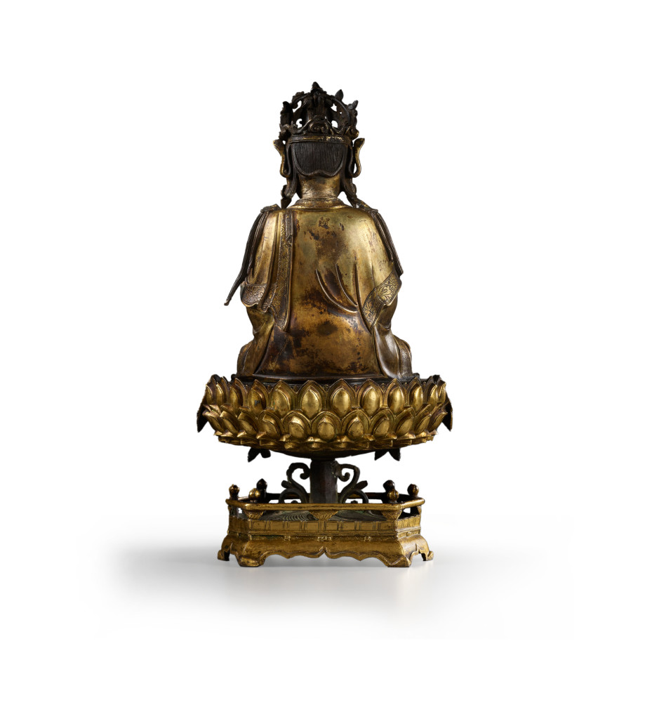 A Chinese gilt-bronze sculpture of Guanyin on a lotus throne pedestal