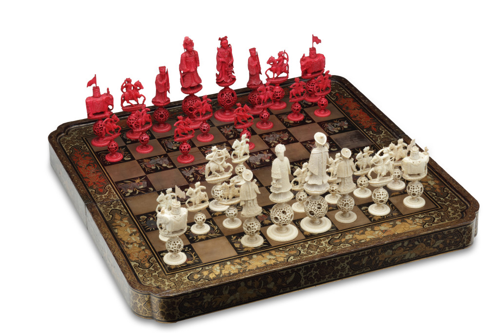 A Chinese lacquer game-chest with ivory chess set