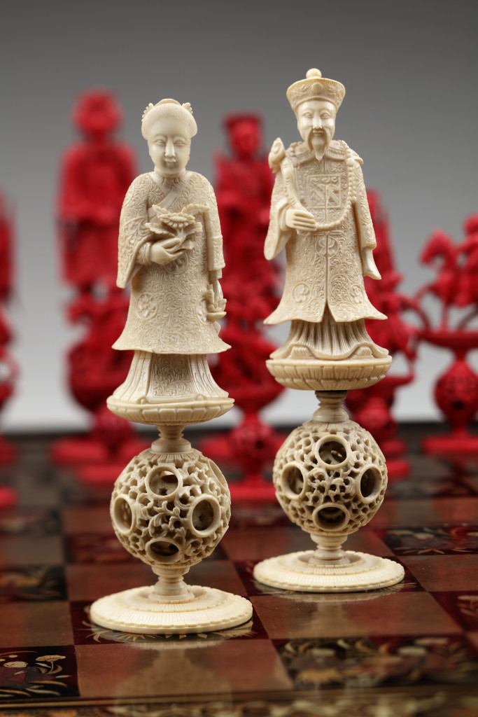 A Chinese lacquer game-chest with ivory chess set
