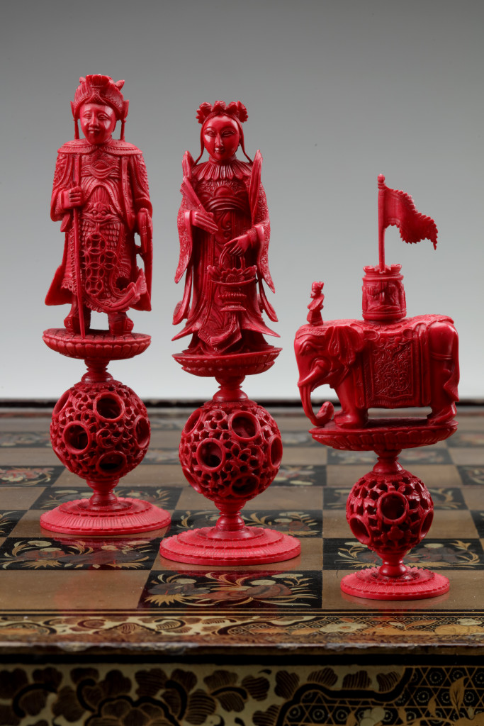 A Chinese lacquer game-chest with ivory chess set