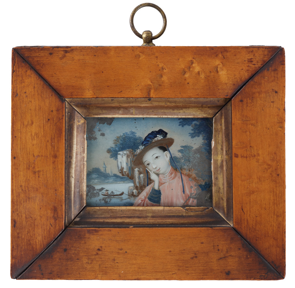 A pair of miniature reverse-glass paintings of ladies in a landscape, in original maple wood frames