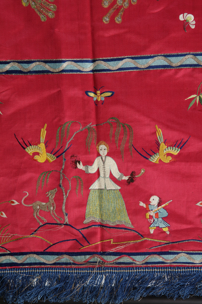 A Chinese red silk embroidered bed-cover for the Dutch market