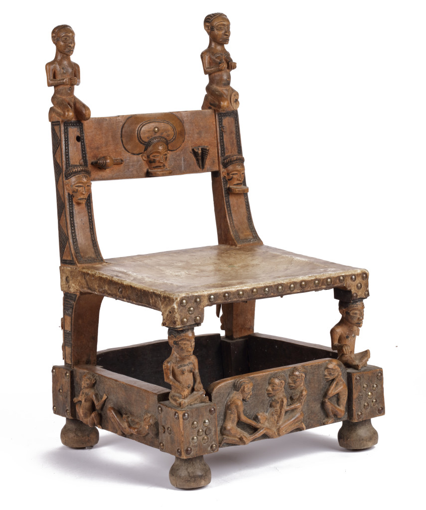 A hardwood (Alstonia spp.) and leather ‘Chokwe’ throne chair with brass  nails