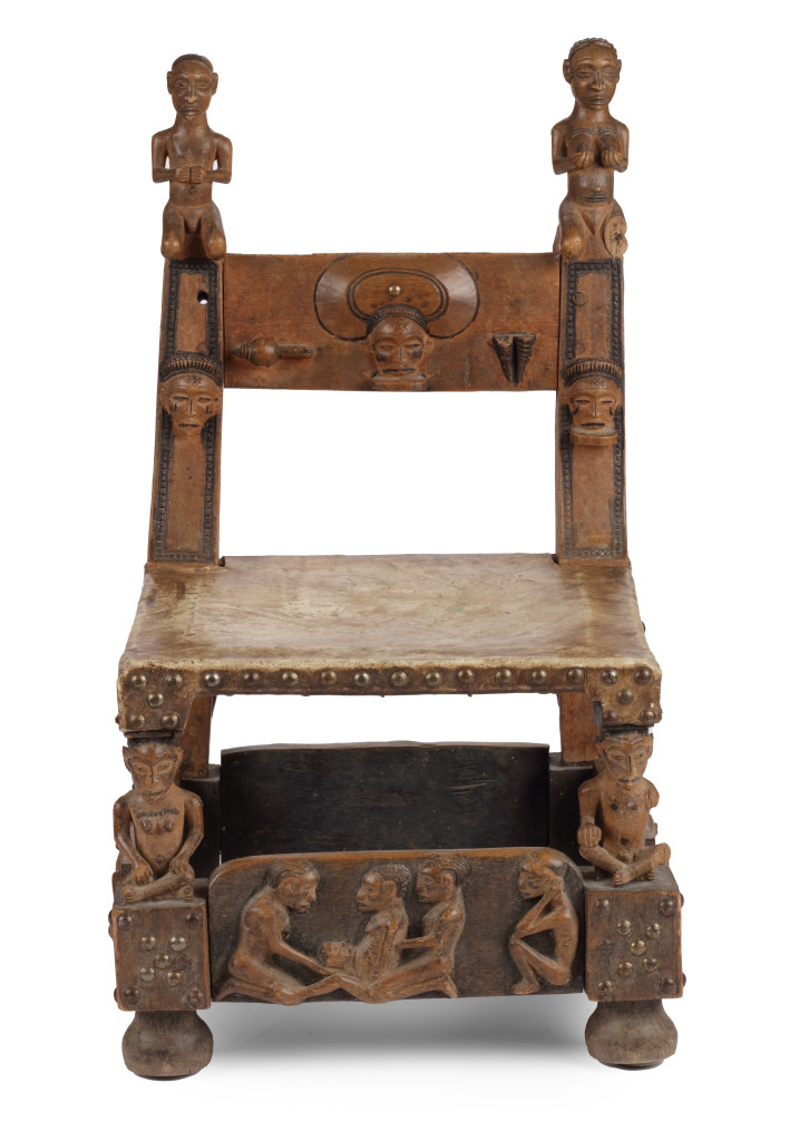 A hardwood (Alstonia spp.) and leather ‘Chokwe’ throne chair with brass  nails