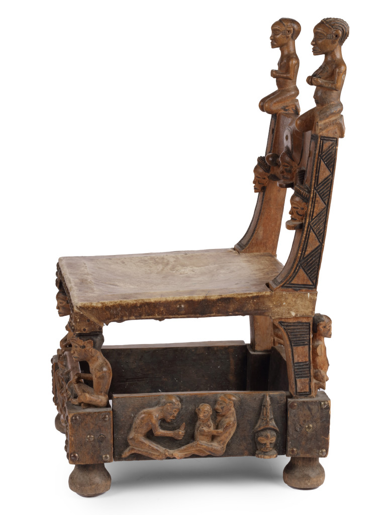 A hardwood (Alstonia spp.) and leather ‘Chokwe’ throne chair with brass  nails