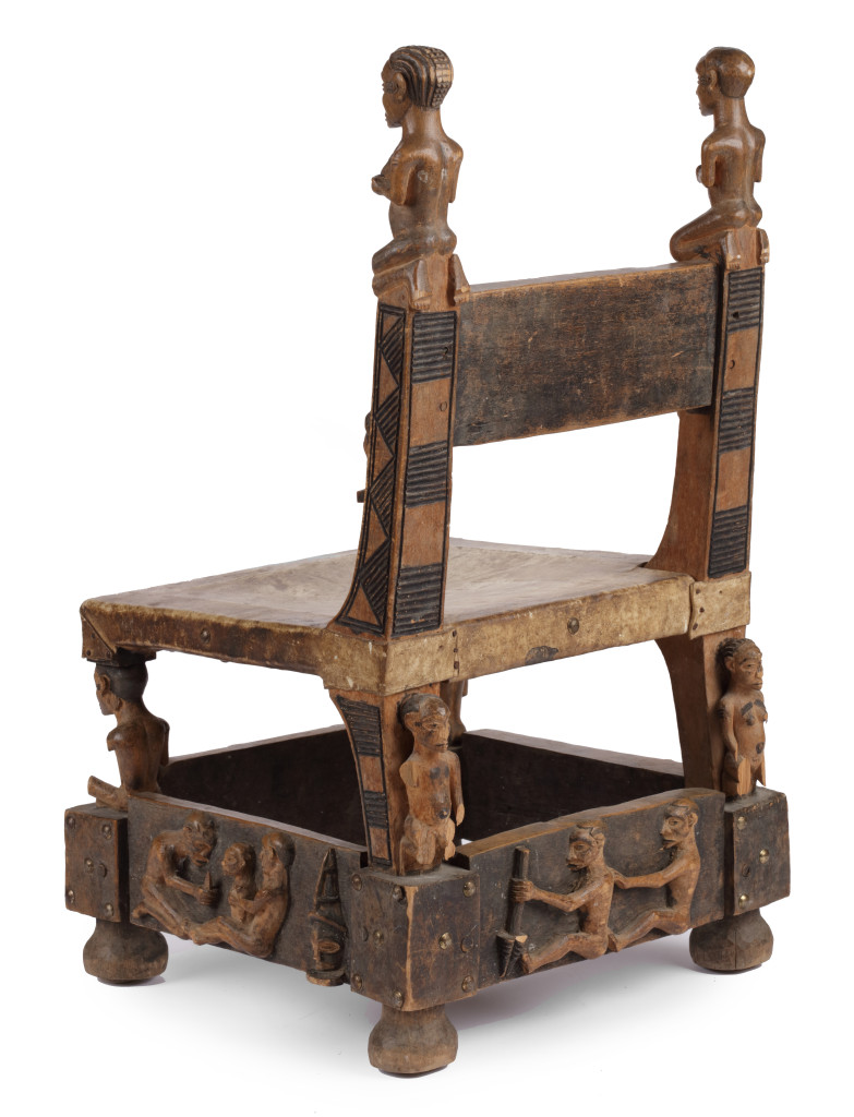 A hardwood (Alstonia spp.) and leather ‘Chokwe’ throne chair with brass  nails