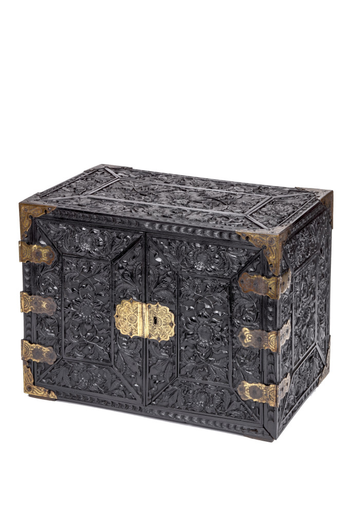 A high-relief carved ebony table cabinet