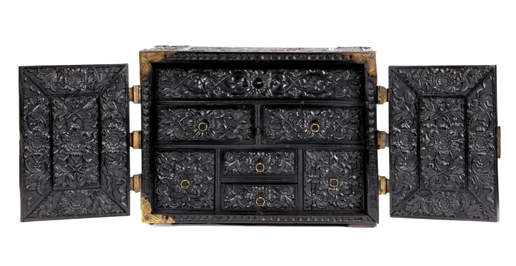 A high-relief carved ebony table cabinet