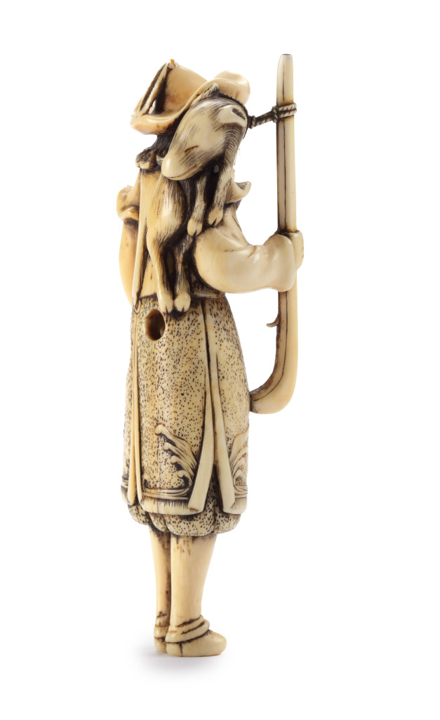 A Japanese netsuke of a Dutchman with a rifle