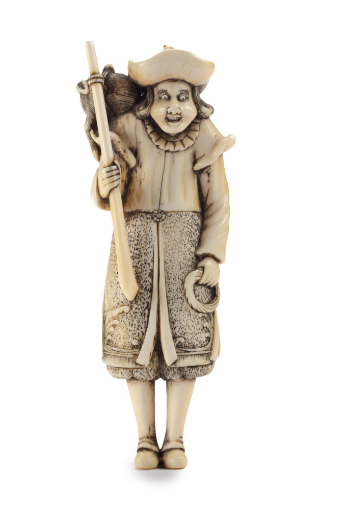 A Japanese netsuke of a Dutchman with a rifle