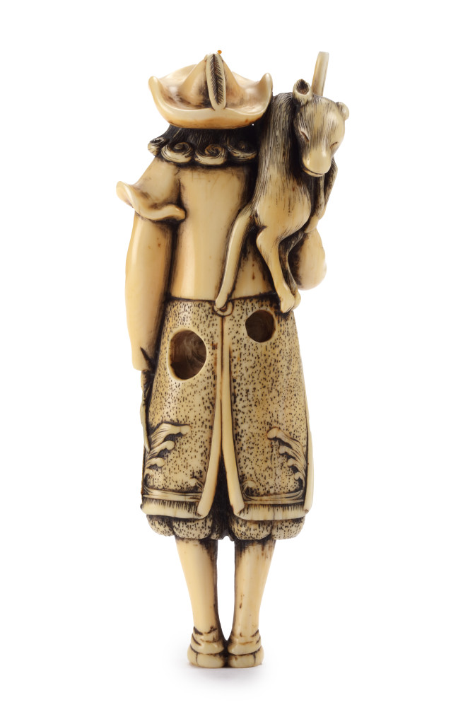 A Japanese netsuke of a Dutchman with a rifle