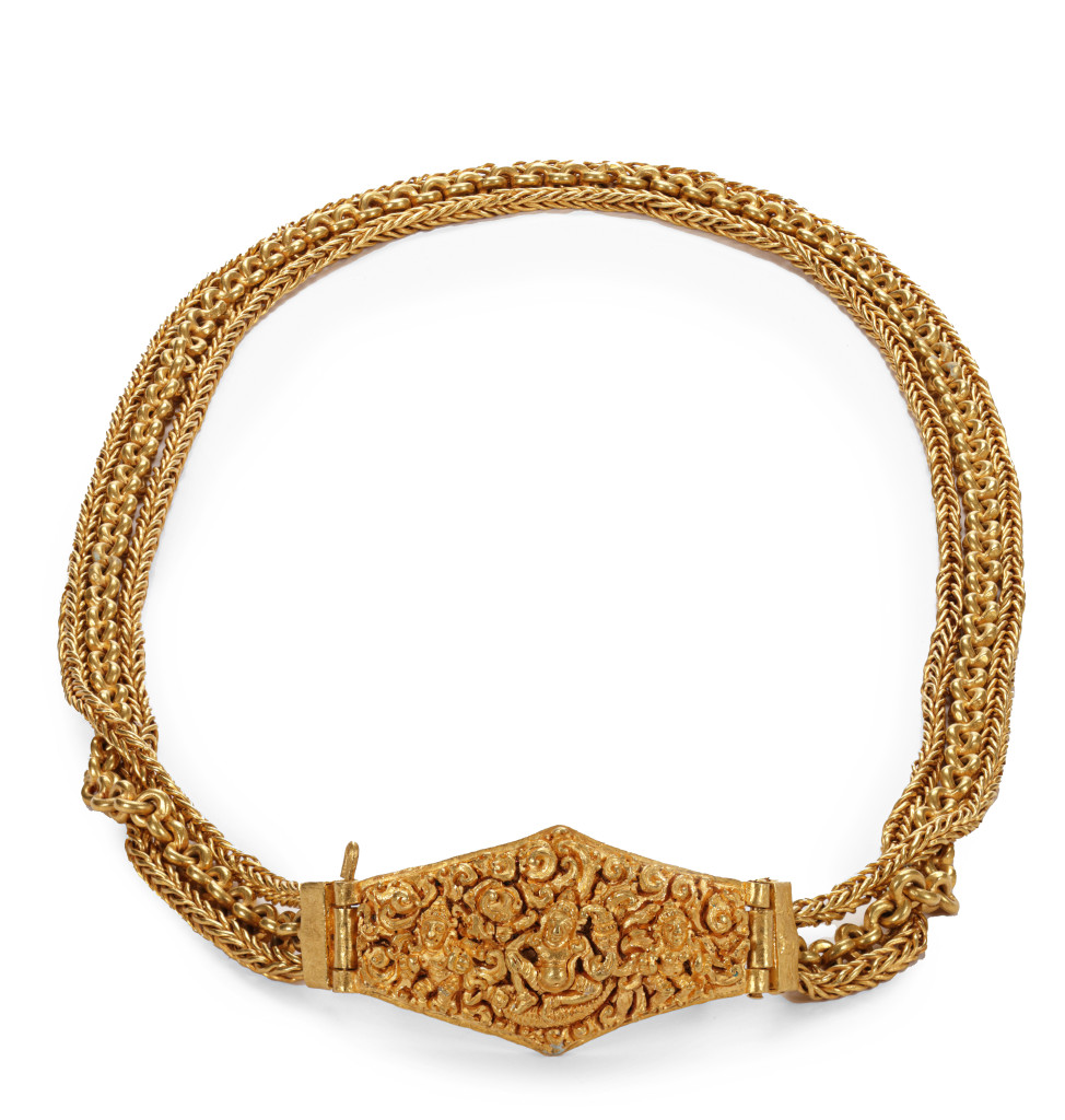 An ancient Javanese solid high-carat near-pure gold pendant on a three-strand chain