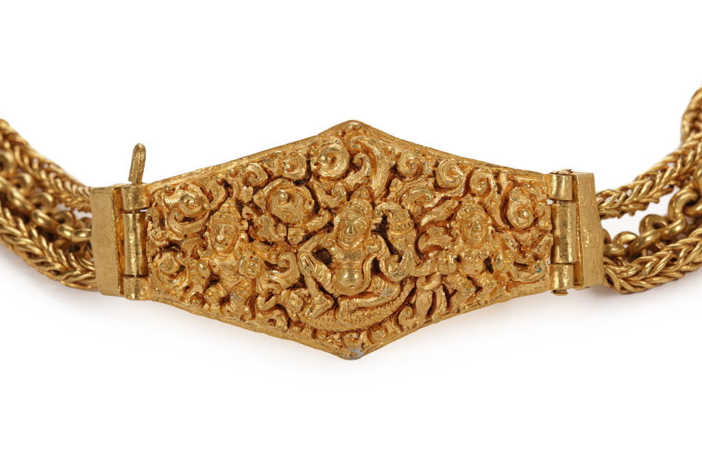 An ancient Javanese solid high-carat near-pure gold pendant on a three-strand chain