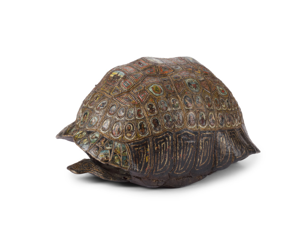 A highly unusual carved painted, gilt and gem-set tortoise carapace resembling the mythical Cosmic or World-bearing Turtle