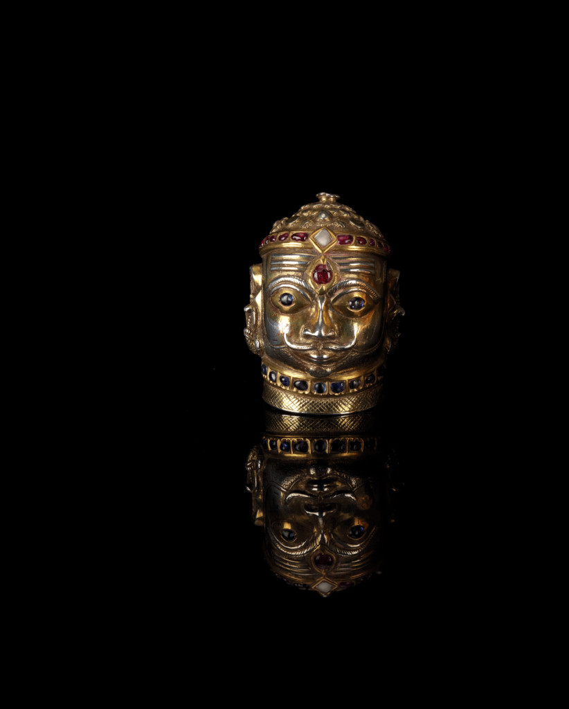 A gem-set silver-gilt Shiva Mukhalingam head