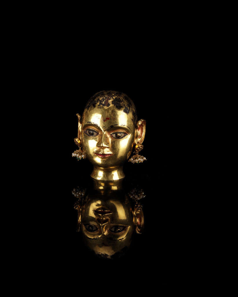 An Indian gem-set gold head of the Goddess Gauri