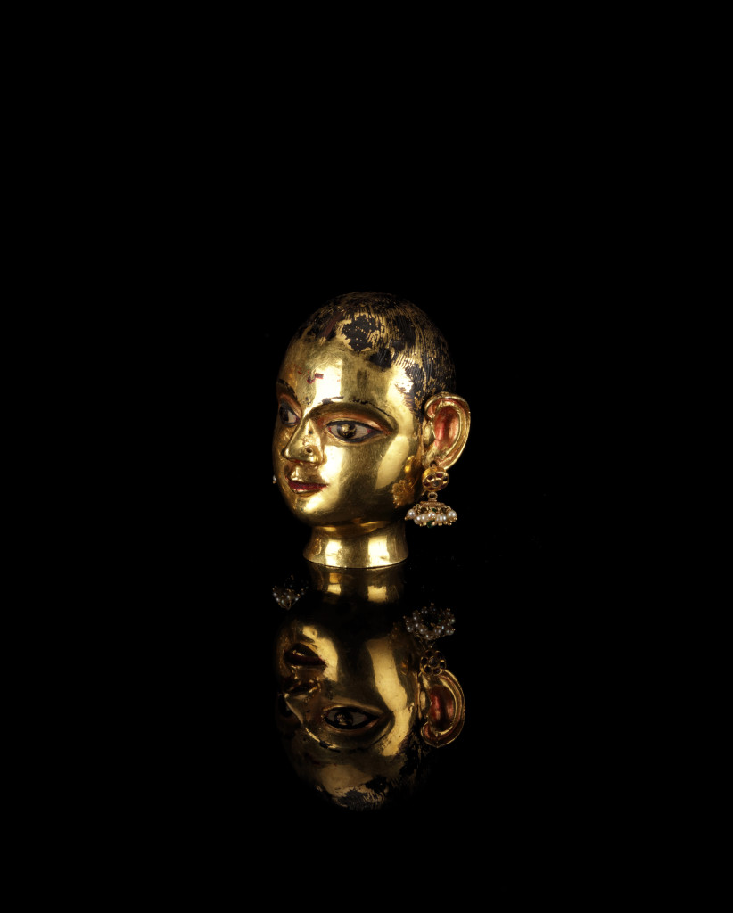 An Indian gem-set gold head of the Goddess Gauri