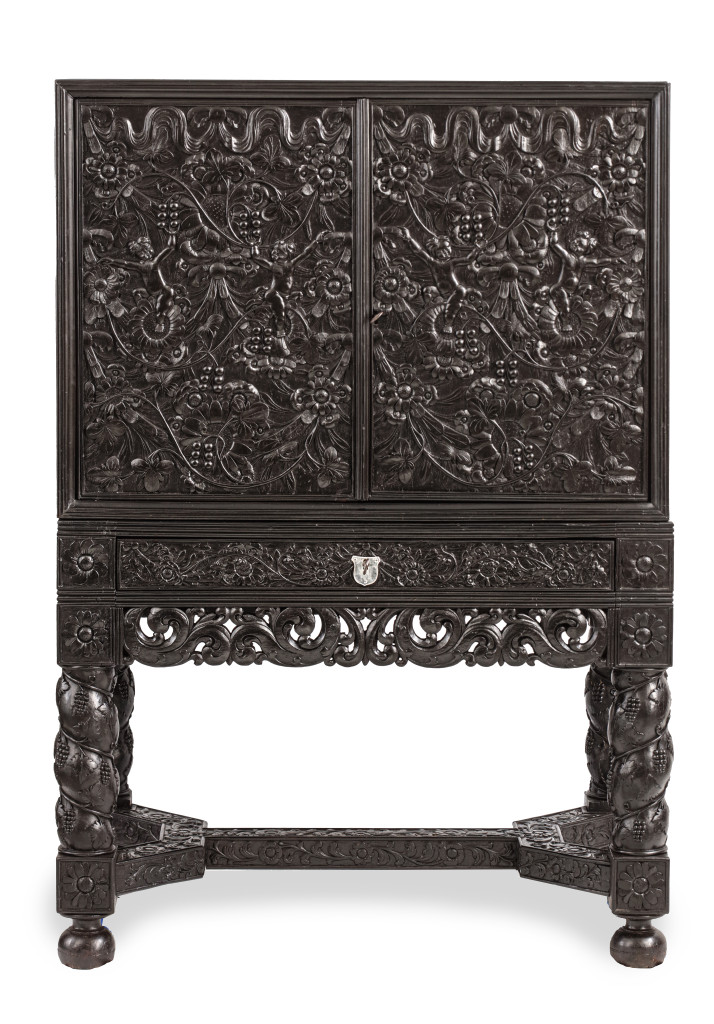 A Dutch-colonial Indonesian ebony cabinet on stand