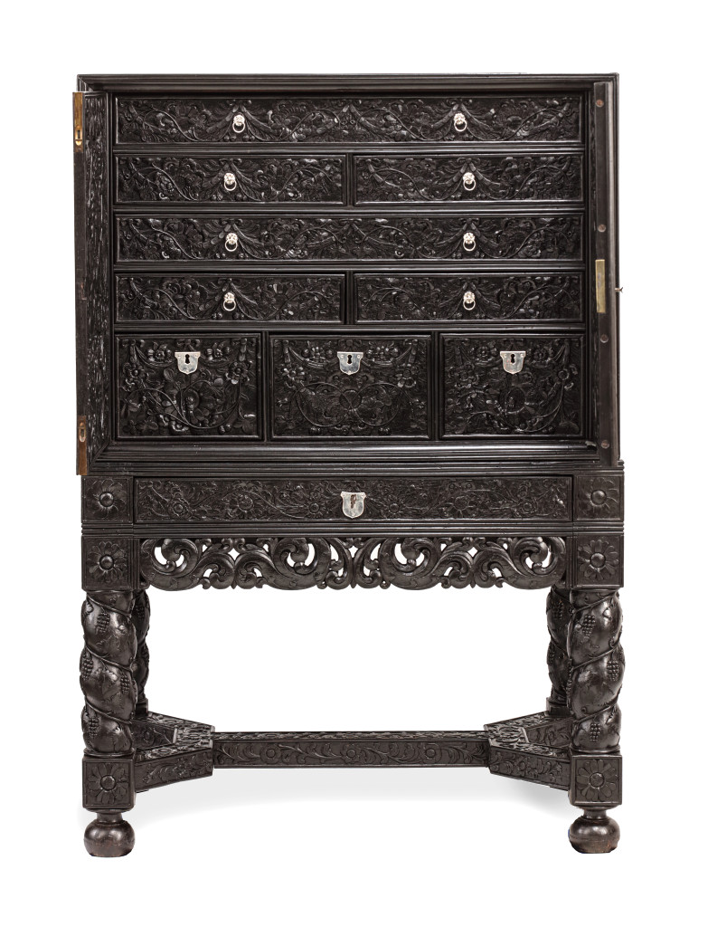 A Dutch-colonial Indonesian ebony cabinet on stand