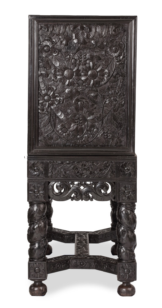 A Dutch-colonial Indonesian ebony cabinet on stand