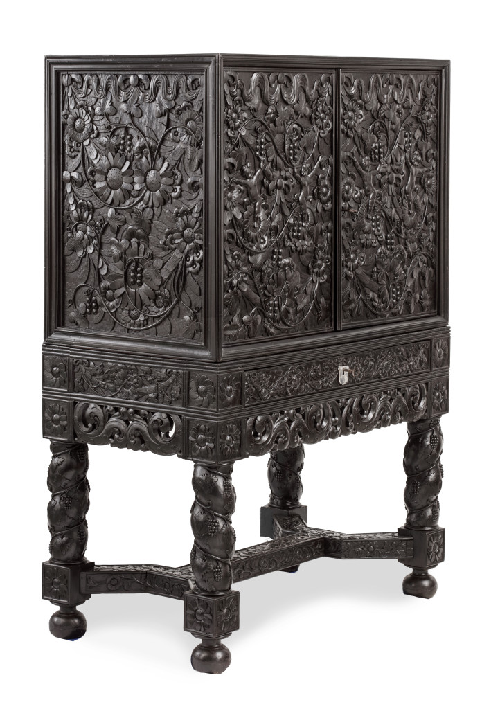 A Dutch-colonial Indonesian ebony cabinet on stand