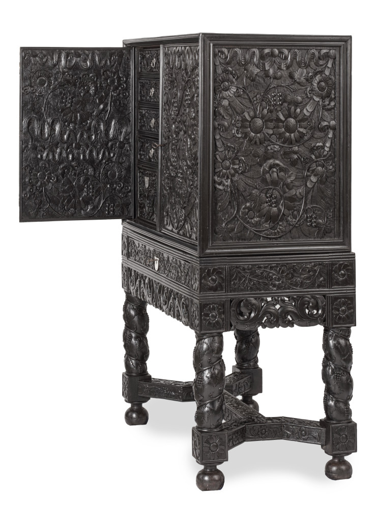 A Dutch-colonial Indonesian ebony cabinet on stand