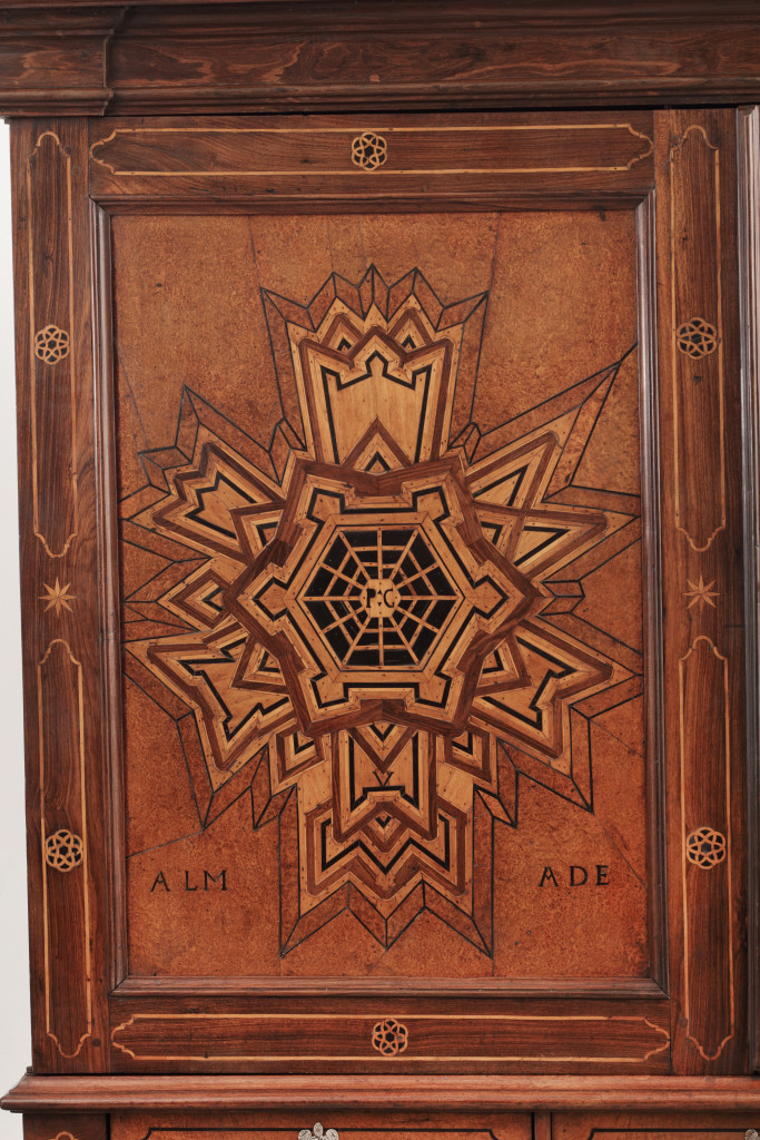 A Dutch-colonial cabinet on stand with marquetry depiction of Fort Almada in Portugal