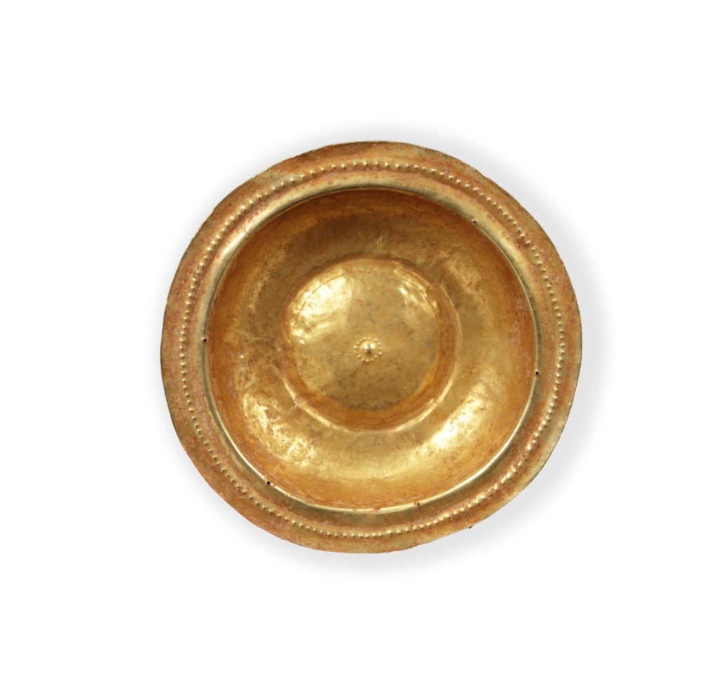 A collection of Tanimbar gold repoussé dishes