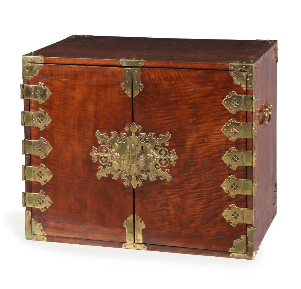 A near pair of Dutch-Colonial Japanese chestnut cabinet chests with brass mounts