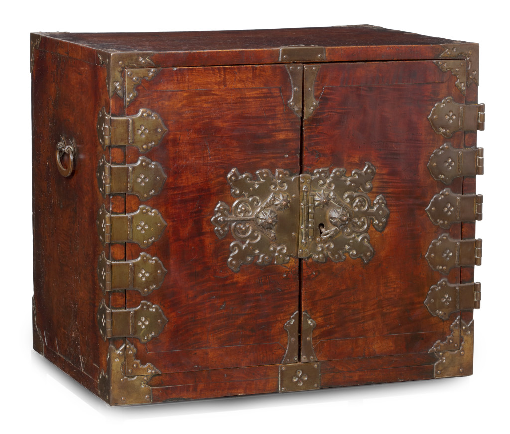 A near pair of Dutch-Colonial Japanese chestnut cabinet chests with brass mounts