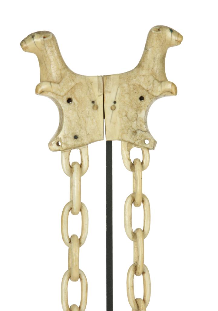 An Inuit walrus ivory kayak harpoon rest