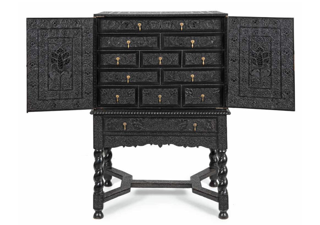 A magnificent low-relief carved ebony cabinet-on-stand