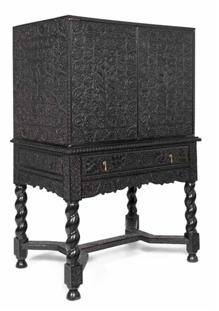 A magnificent low-relief carved ebony cabinet-on-stand