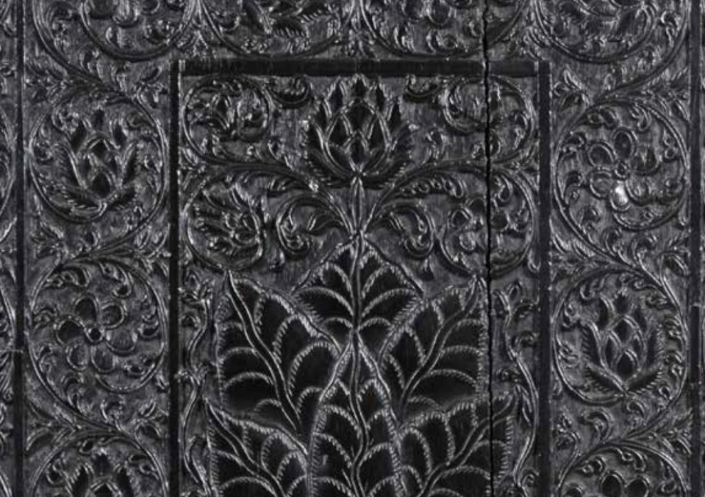 A magnificent low-relief carved ebony cabinet-on-stand