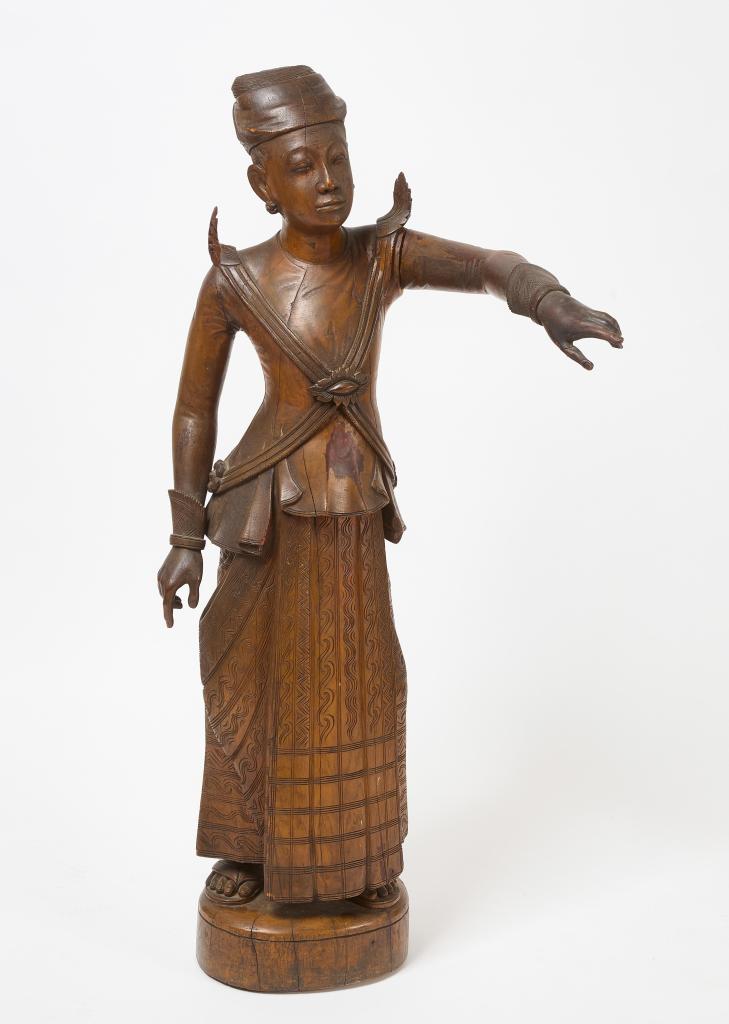 A large Mandalay teakwood altar sculpture of a guardian attendant