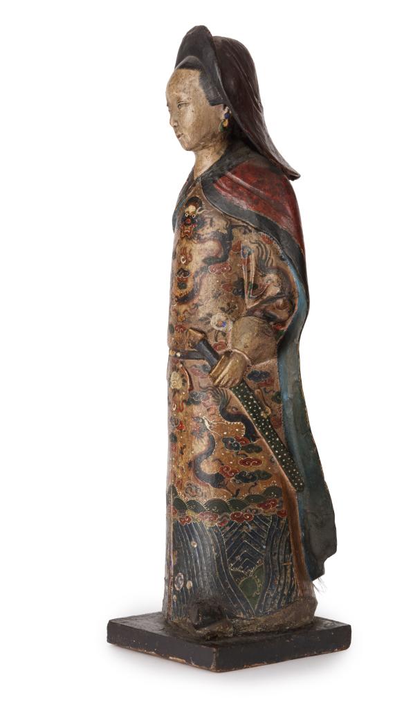 A large Chinese export unfired-clay polychrome painted figure of a female deity