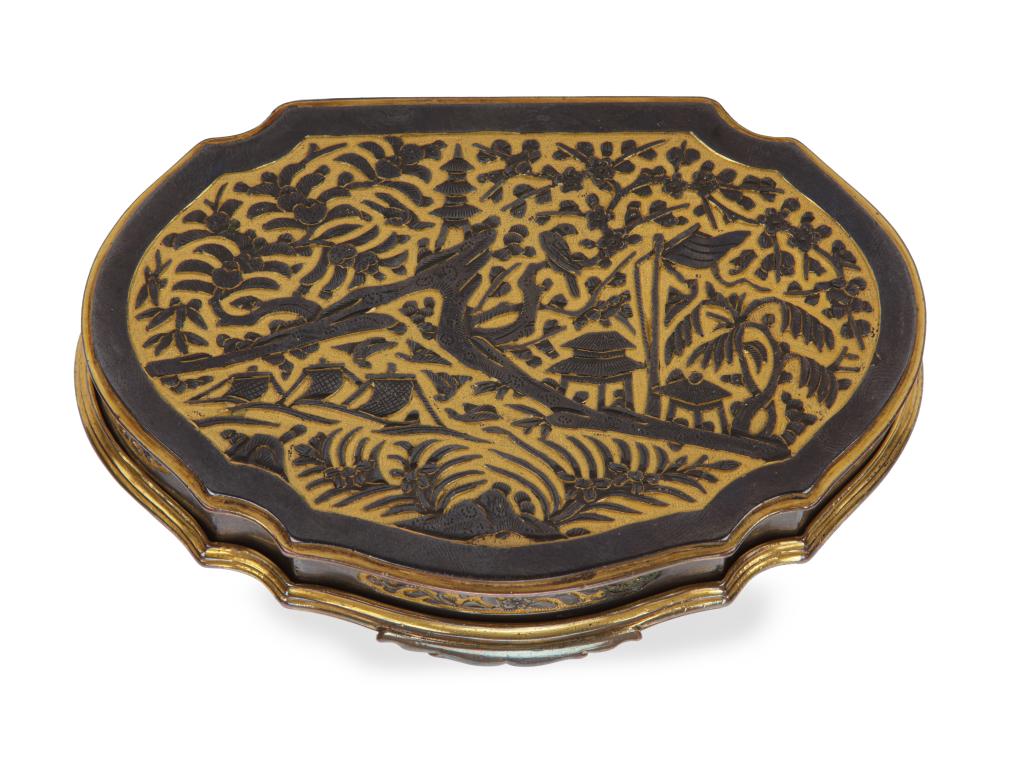 A ruyi-shaped Shakudo-style erotic tobacco or snuff box, relief-decorated with silvered applied figures