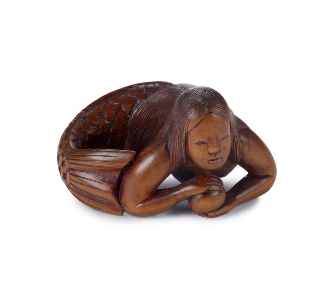 A boxwood netsuke of a mermaid by Hozan