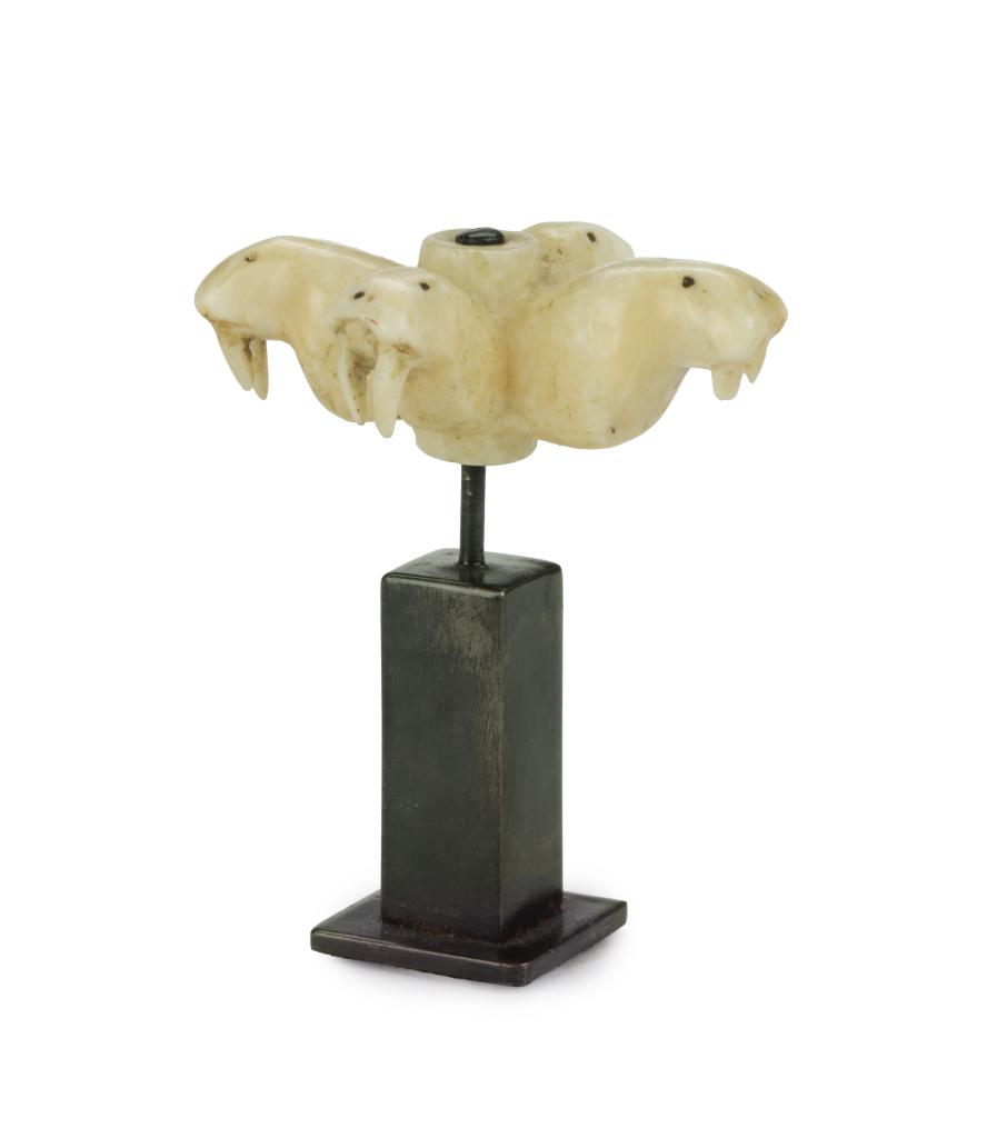 An Inuit marine ivory sculpture in the form of four walrus heads