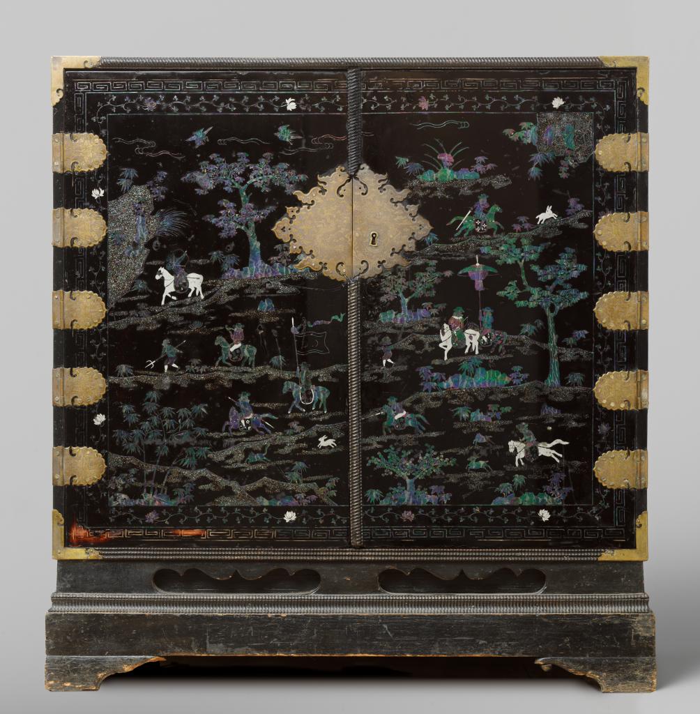 A Chinese mother-of-pearl and silver inlaid lacquered cabinet with depictions of Dutchmen