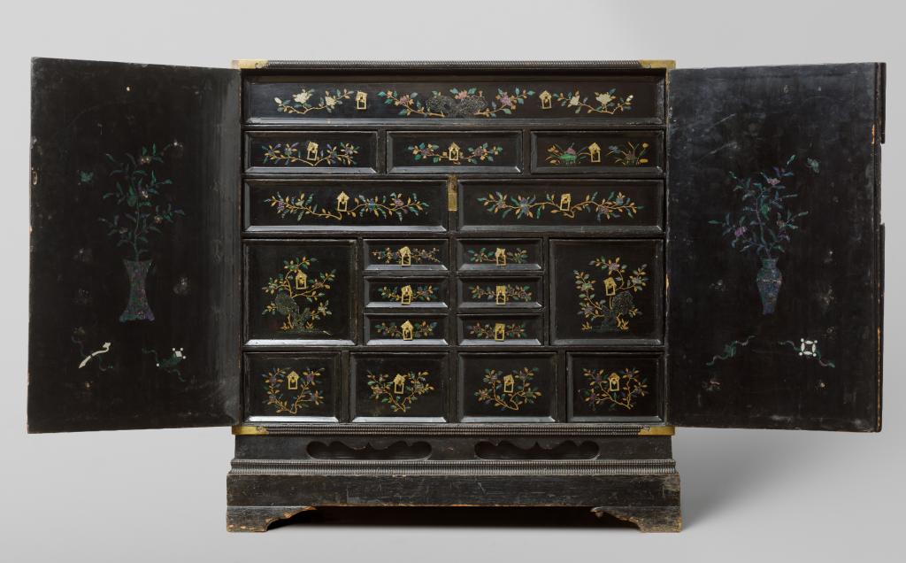 A Chinese mother-of-pearl and silver inlaid lacquered cabinet with depictions of Dutchmen