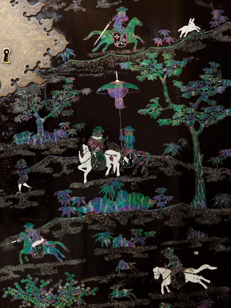 A Chinese mother-of-pearl and silver inlaid lacquered cabinet with depictions of Dutchmen