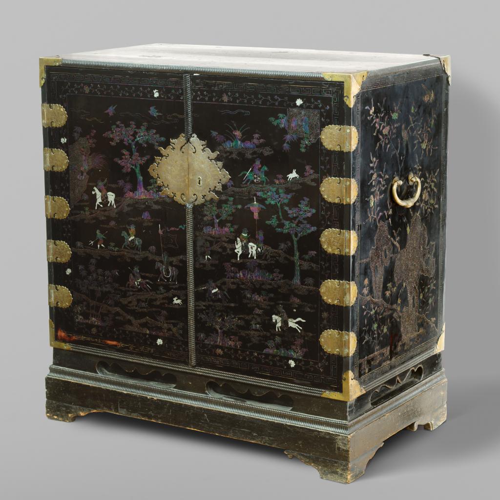 A Chinese mother-of-pearl and silver inlaid lacquered cabinet with depictions of Dutchmen