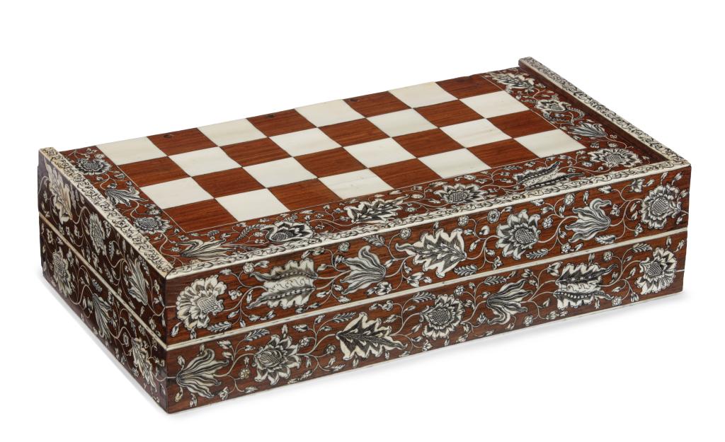 A superb Indian 'Vizagapatam' pen-engraved bone inlaid rosewood folding games board with period Indian ivory part-stained chess-set