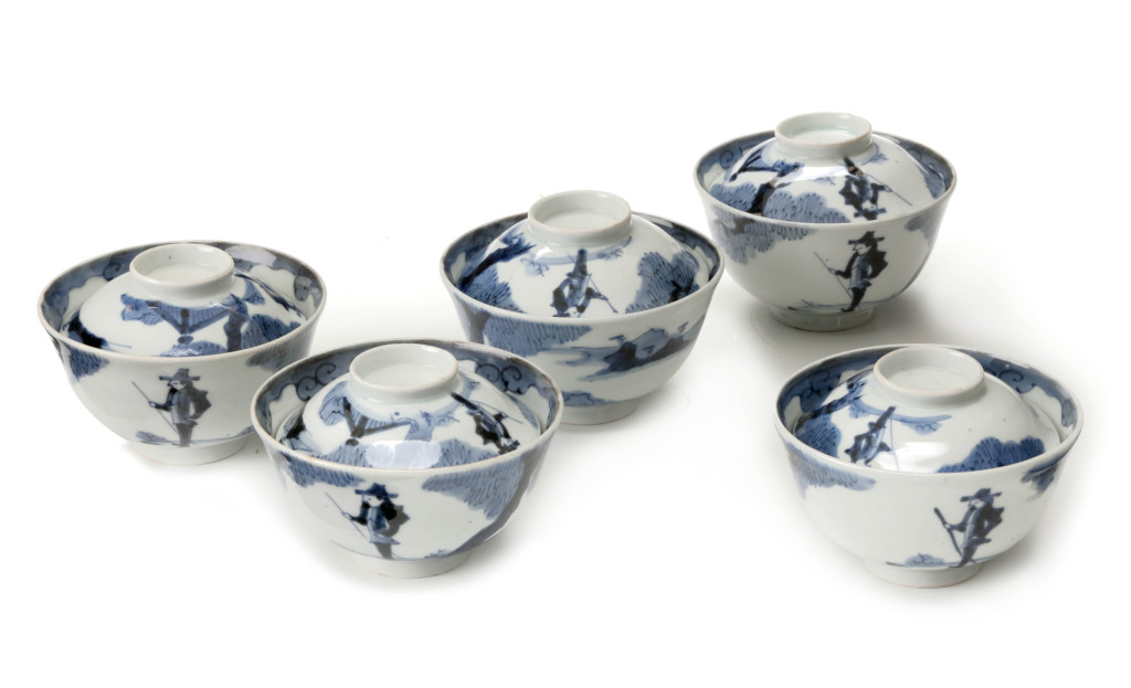 A set of five Arita blue and white porcelain 'Dutchmen' bowls with covers