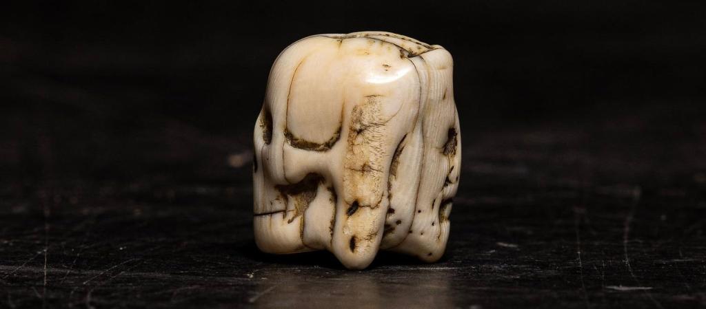 A Flemish carved ivory Janus-faced Vanitas Paternoster Rosary bead