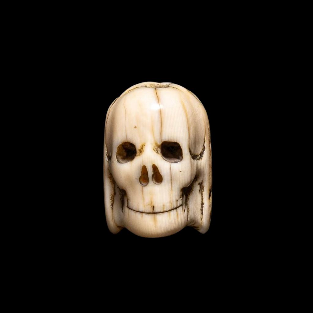 A Flemish carved ivory Janus-faced Vanitas Paternoster Rosary bead